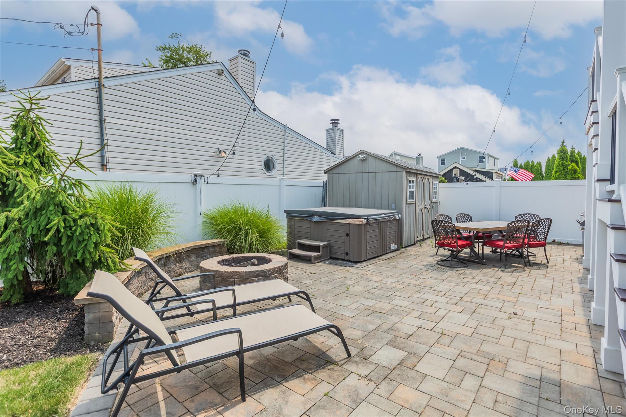 401 Little East Neck Road South Babylon, NY 11702 - Photo 30 of 32 Backyard with Paver Patio, Large Shed and Heated Jacuzzi Tub
