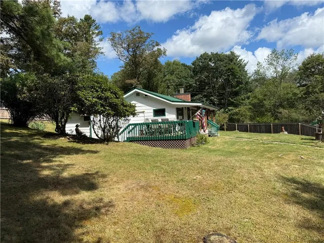 a view of backyard with trees