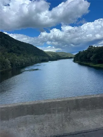 a view of outdoor space with deck and yard