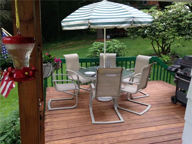 a view of a table and chairs in patio of the house