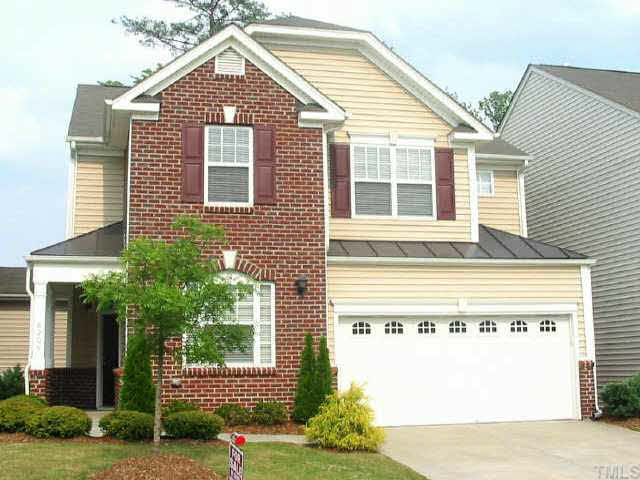 8206 Stone Cellar Drive Raleigh, NC 27613 - Photo 1 of 10 a view of a house with a small yard and potted plants