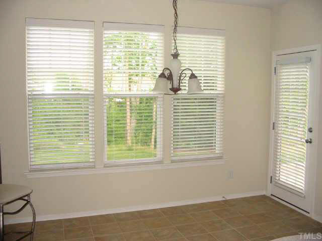8206 Stone Cellar Drive Raleigh, NC 27613 - Photo 6 of 10 a view of an empty room with a window