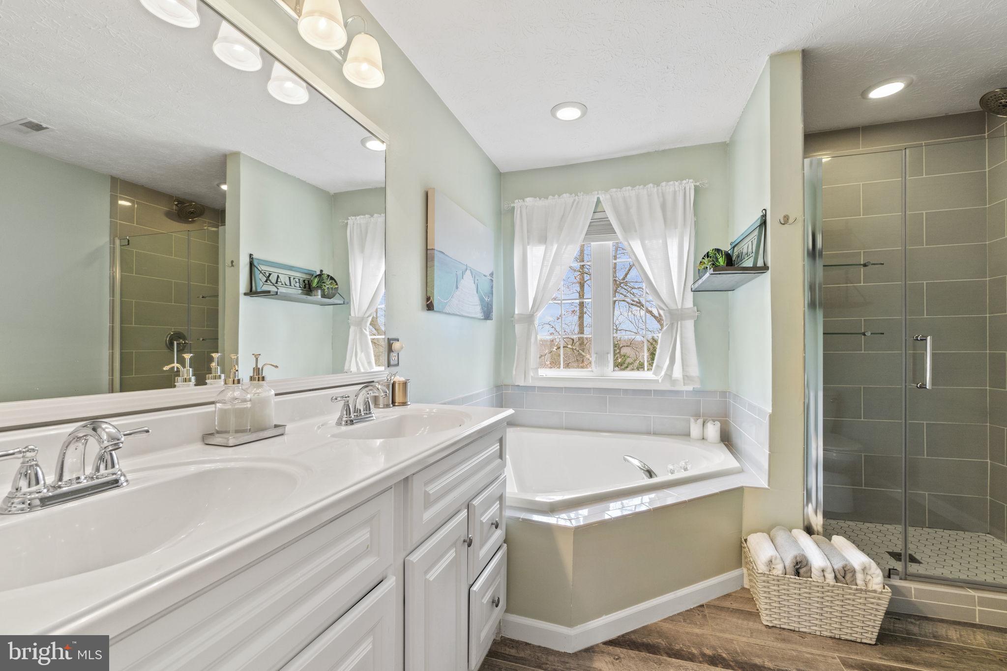 7820 Shallowbrook Court Severn, MD 21144 - Photo 16 of 35 Primary bath with fully renovated glass shower