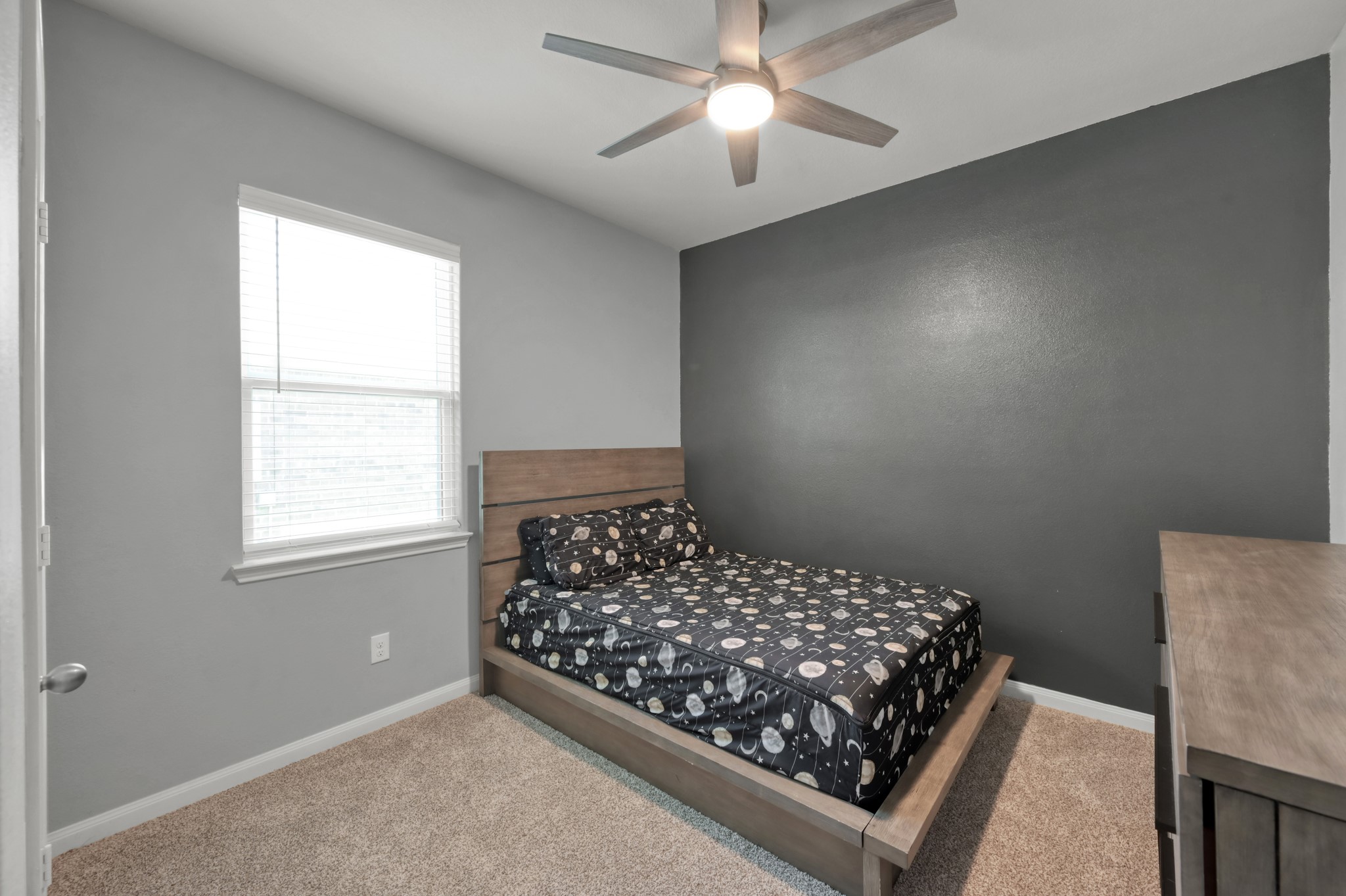 7562 Fettle Lane Conroe, TX 77304 - Photo 20 of 30 Versatile bedroom with stylish accent wall and flexible layout options.