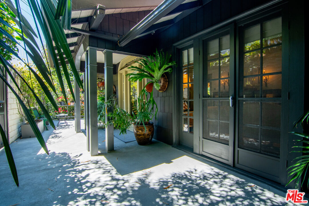 1918 Pinehurst Road Los Angeles, CA 90068 - Photo 2 of 66 a view of a porch with chairs and potted plant