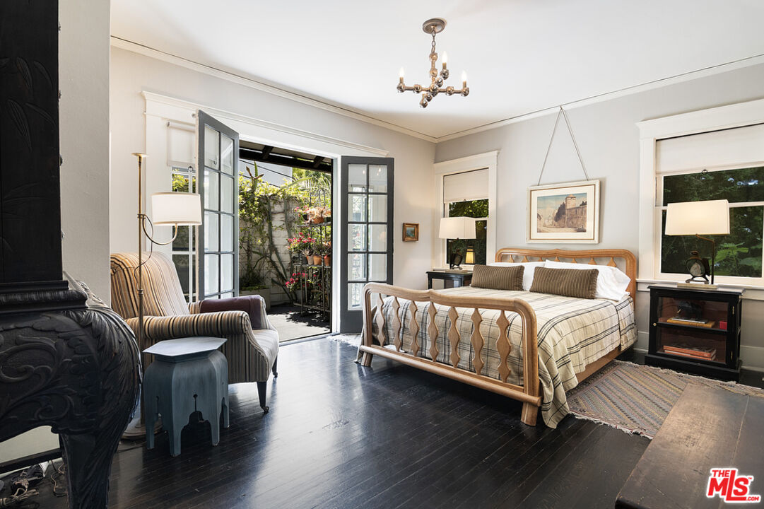 1918 Pinehurst Road Los Angeles, CA 90068 - Photo 28 of 66 a bedroom with a bed and wooden floor