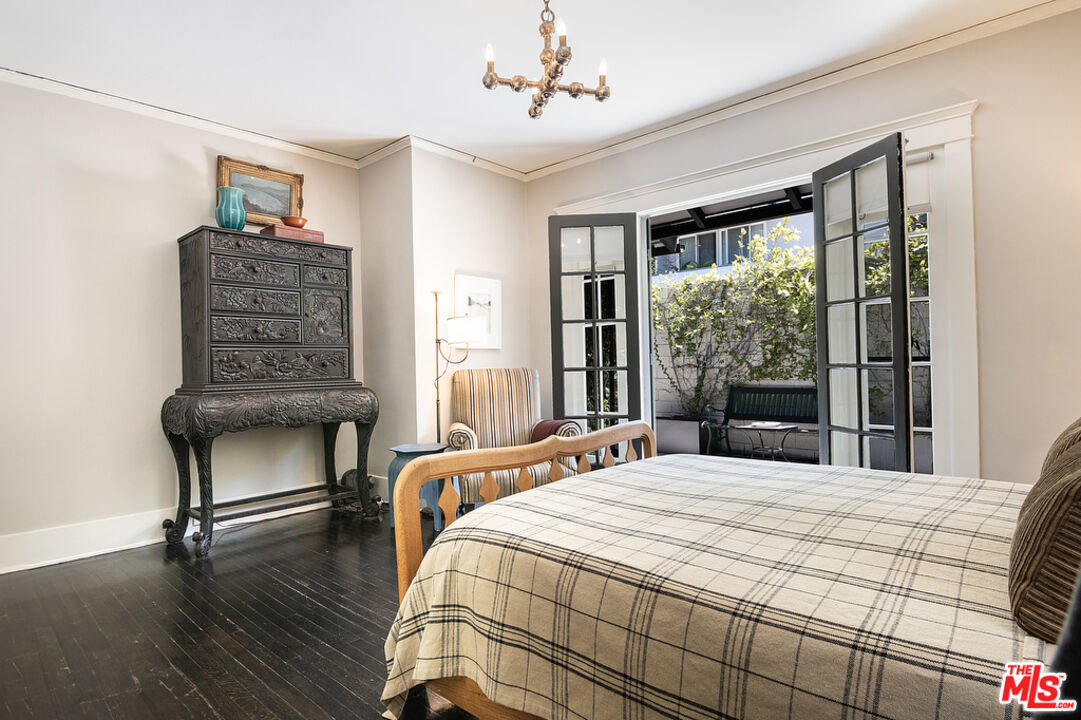 1918 Pinehurst Road Los Angeles, CA 90068 - Photo 30 of 66 a bedroom with a bed and a chair