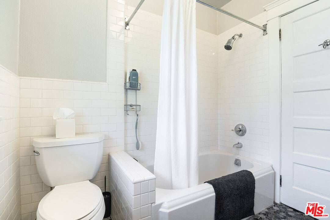 1918 Pinehurst Road Los Angeles, CA 90068 - Photo 32 of 66 a white toilet sitting next to a bath tub shower