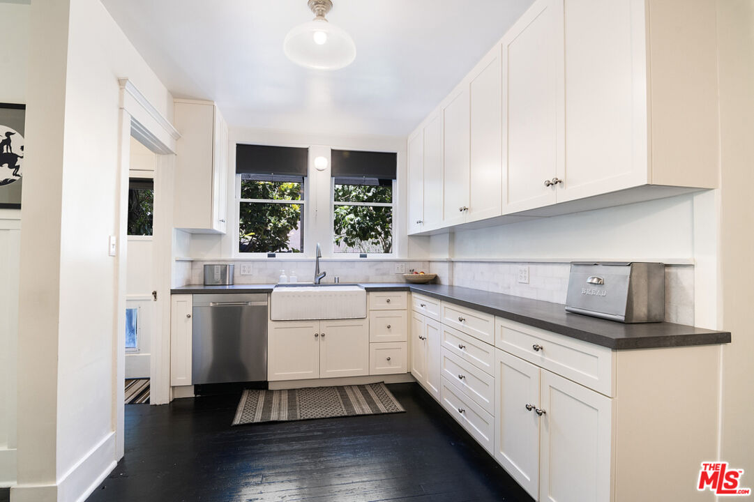 1918 Pinehurst Road Los Angeles, CA 90068 - Photo 40 of 66 a kitchen with white cabinets and white appliances