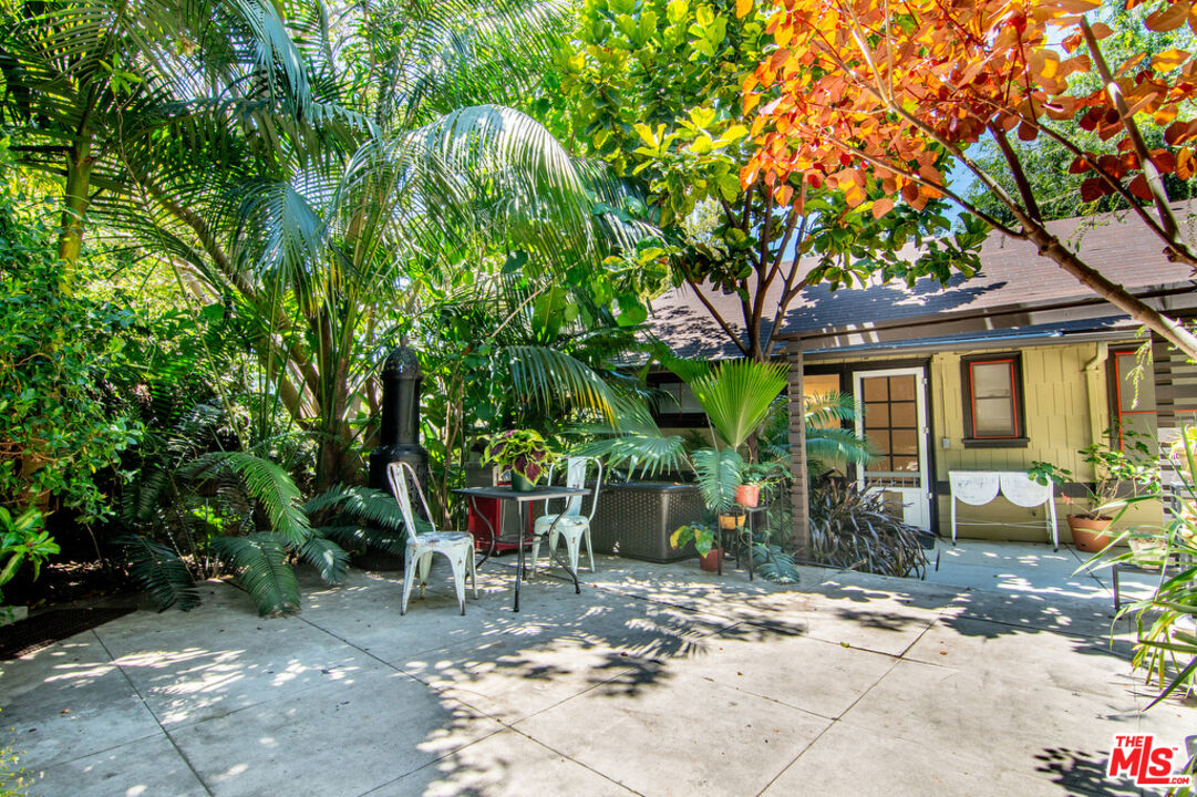 1918 Pinehurst Road Los Angeles, CA 90068 - Photo 45 of 66 a view of a patio with table and chairs and potted plants