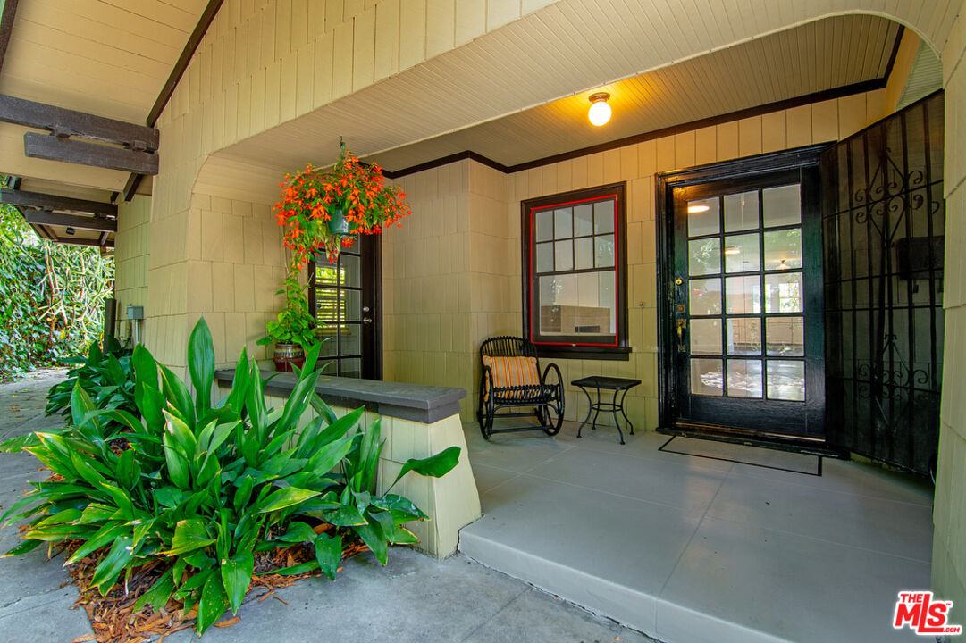 1918 Pinehurst Road Los Angeles, CA 90068 - Photo 51 of 66 a view of a porch with chairs and potted plants