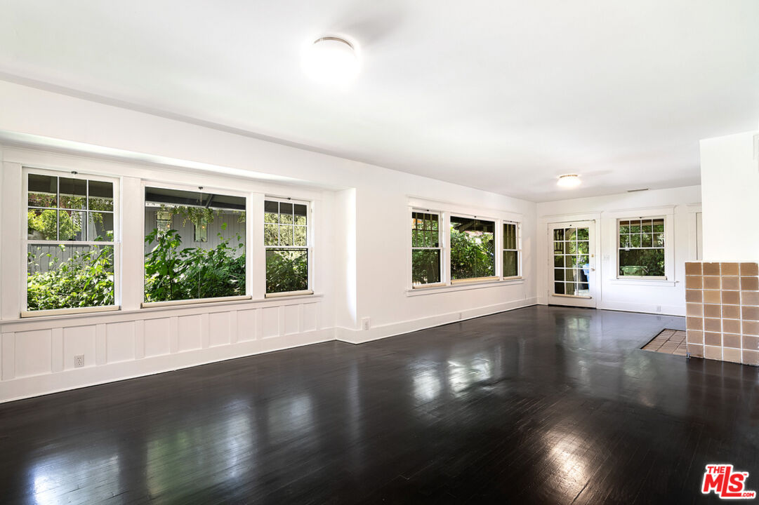 1918 Pinehurst Road Los Angeles, CA 90068 - Photo 53 of 66 a view of empty room with wooden floor and fan