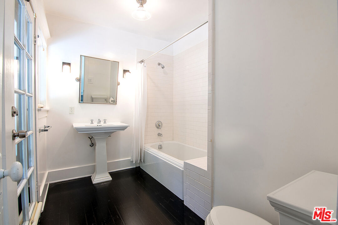 1918 Pinehurst Road Los Angeles, CA 90068 - Photo 58 of 66 a bathroom with a sink a toilet and shower