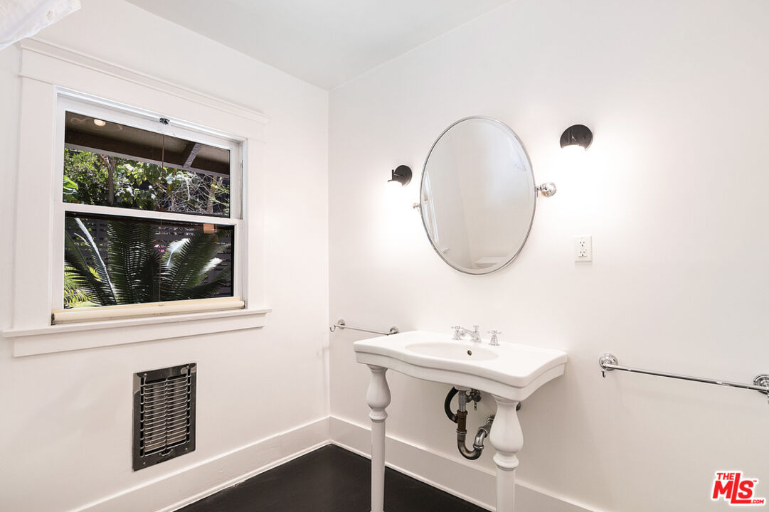 1918 Pinehurst Road Los Angeles, CA 90068 - Photo 59 of 66 a bathroom with a sink and a mirror