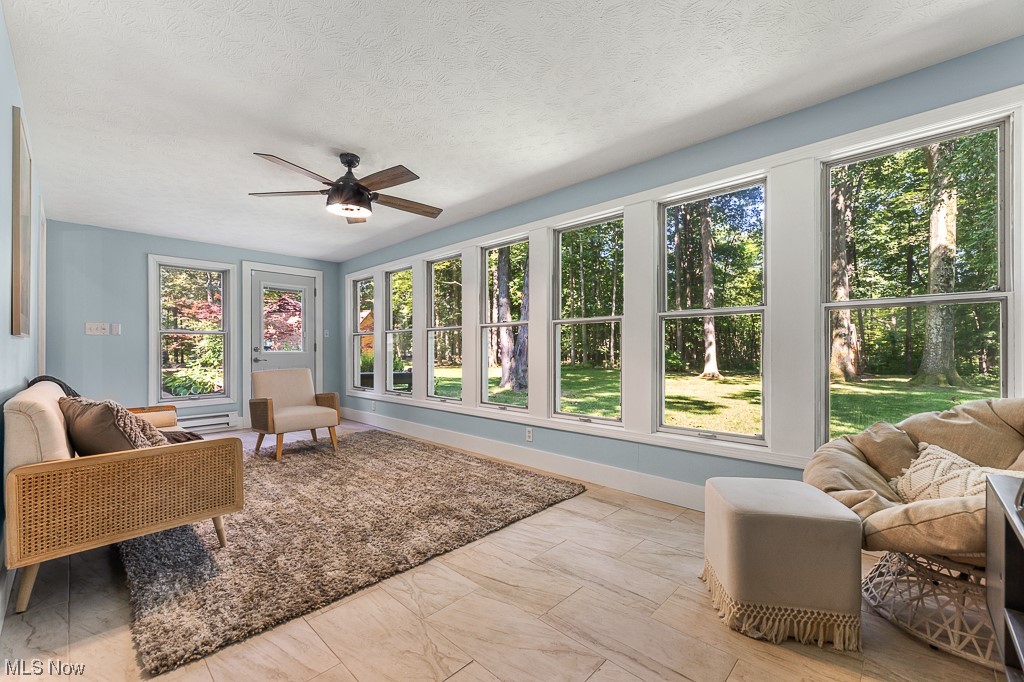 32261 Cedar Road Cleveland, OH 44124 - Photo 17 of 35 Sunroom/Bonus room with a textured ceiling, plenty of natural light, ceiling fan, and light tile floors