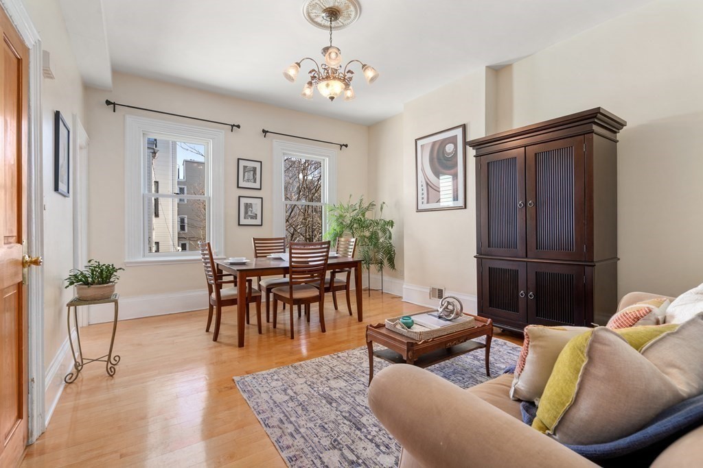 45 Baldwin Street, Unit 2 Boston, MA 02129 - Photo 3 of 12 a living room with furniture two window and a table