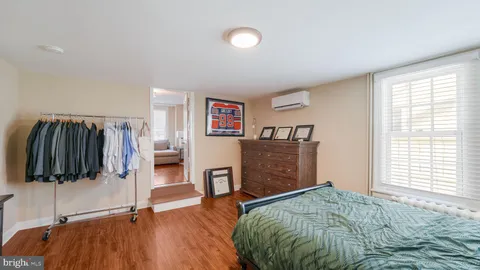 a bathroom with a granite countertop sink mirror and shower