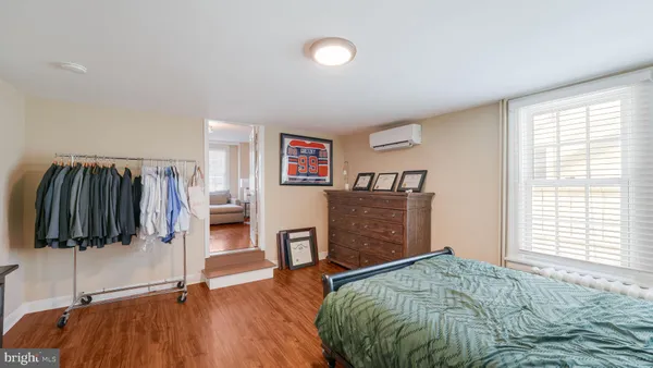 a bathroom with a granite countertop sink mirror and shower