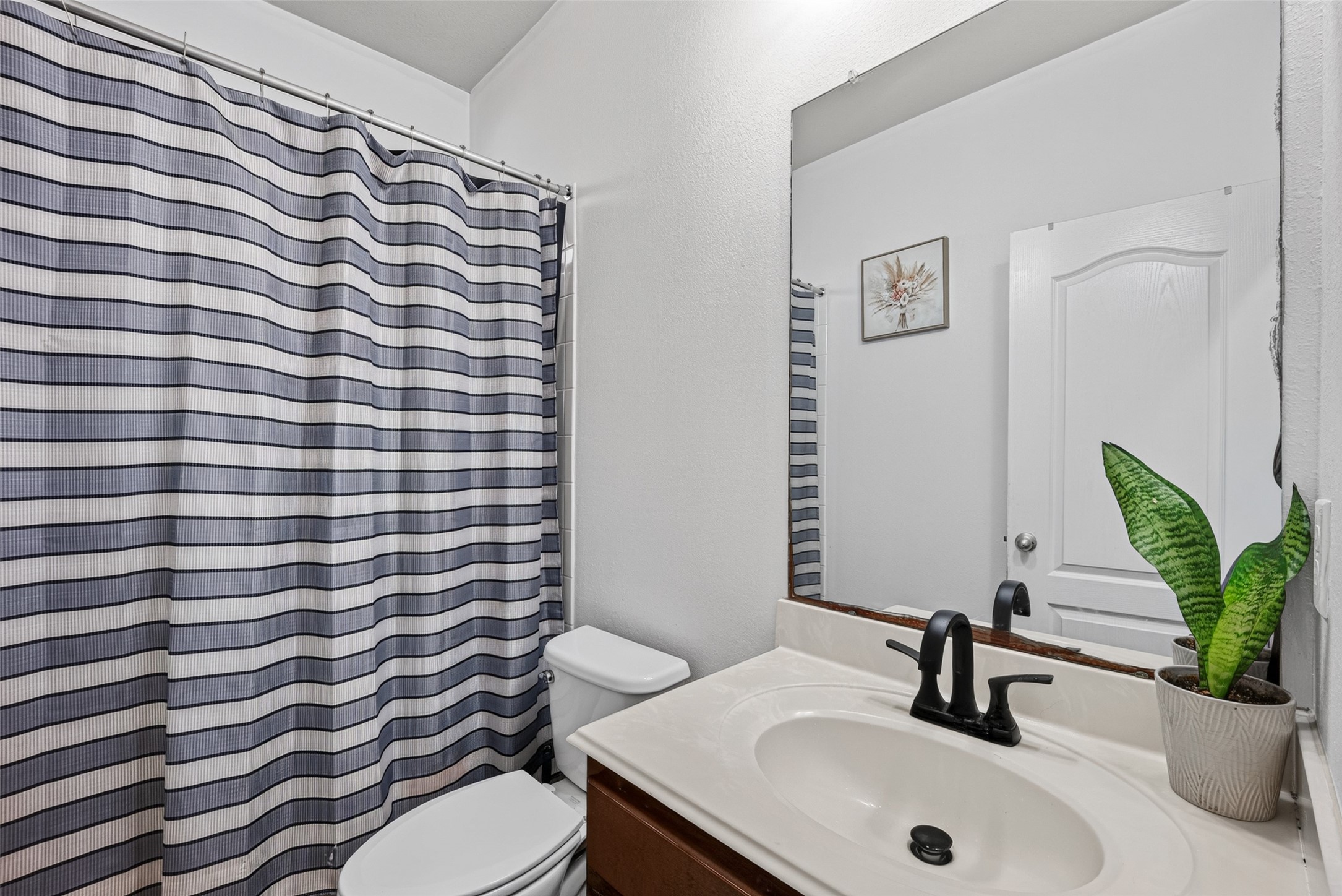 9314 Fuqua Ridge Lane Houston, TX 77075 - Photo 15 of 24 a bathroom with a sink toilet and mirror