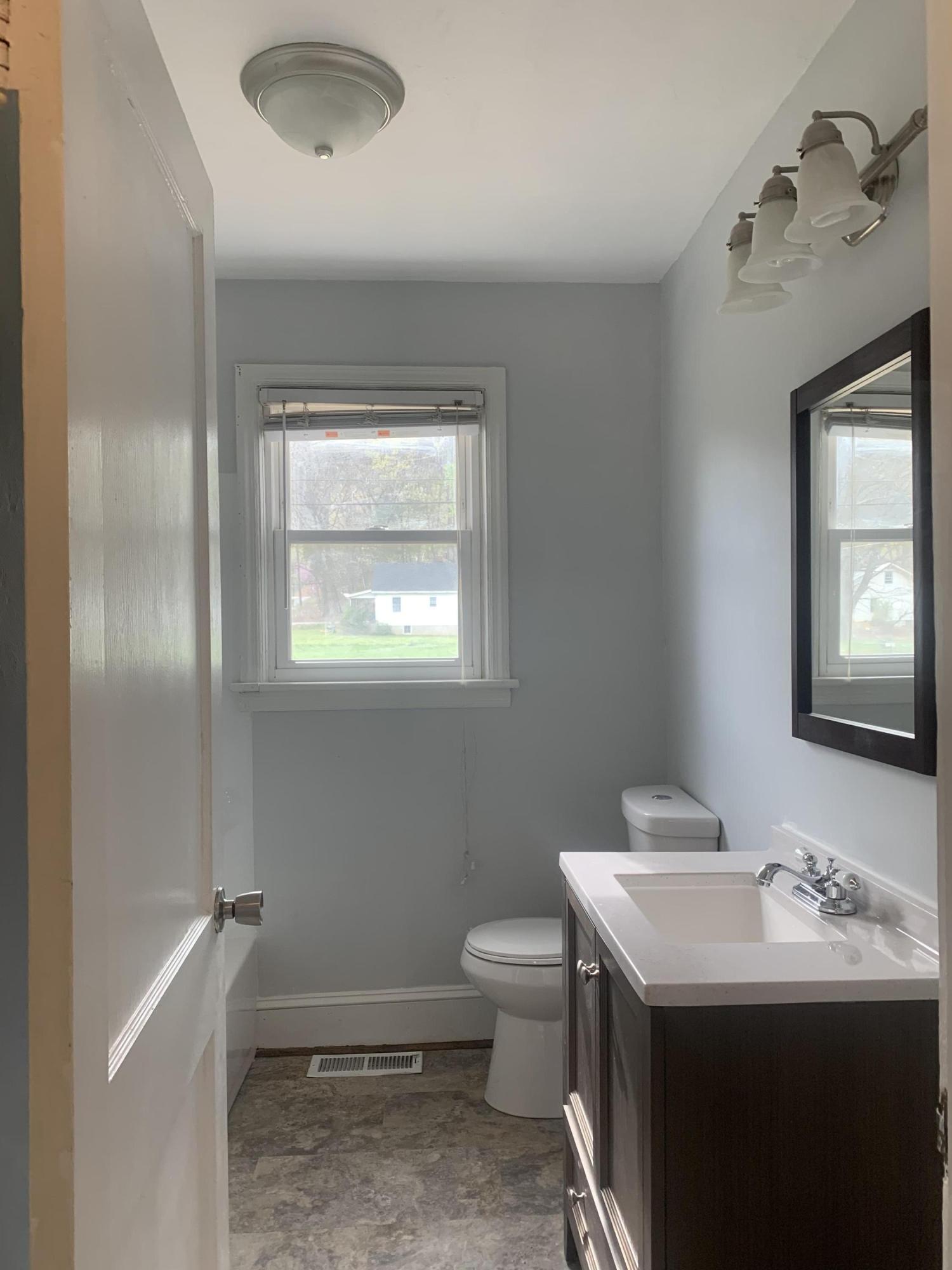 4704 Goodman Road Roanoke, VA 24014 - Photo 11 of 25 a bathroom with a sink and a toilet