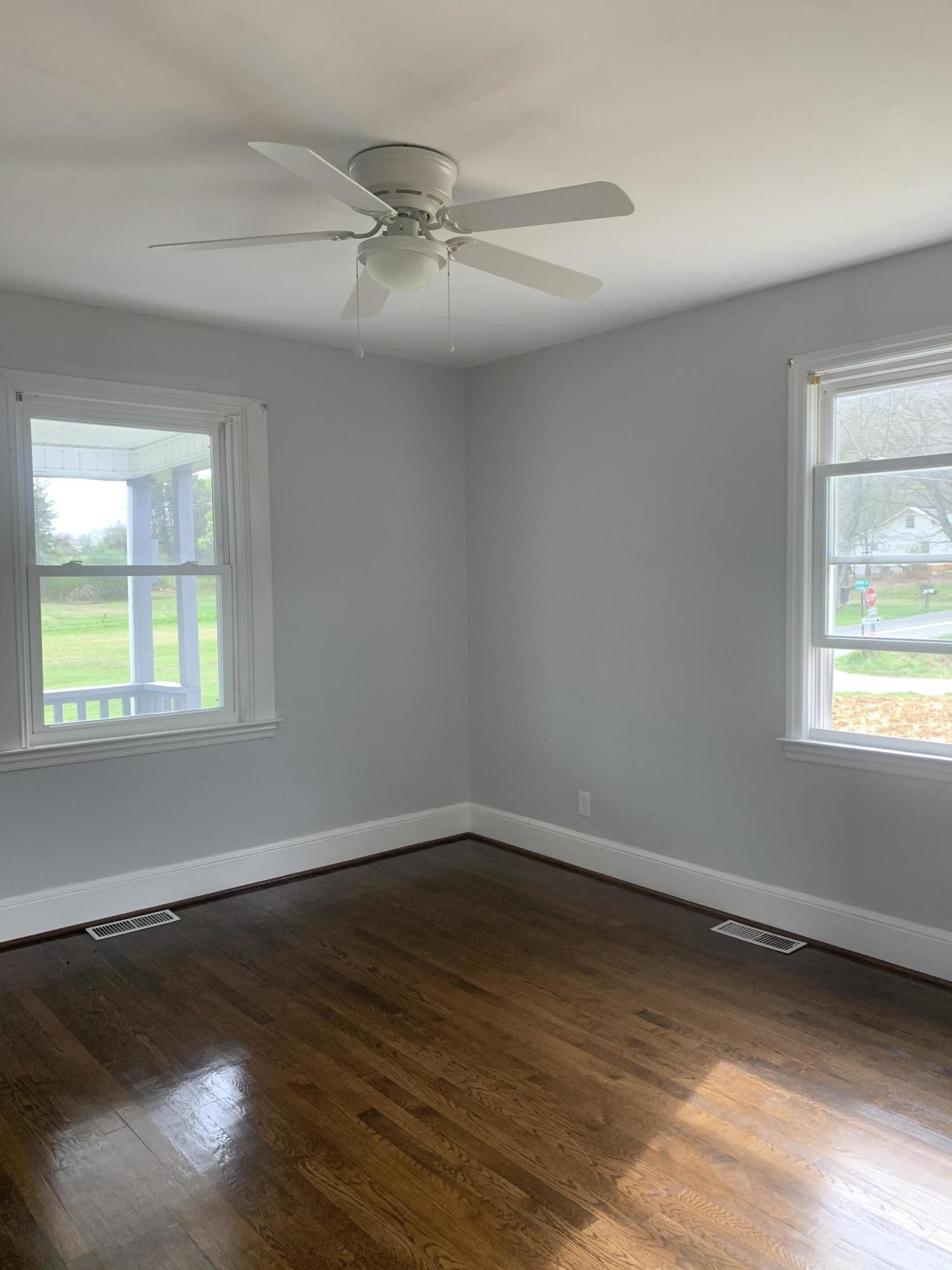 4704 Goodman Road Roanoke, VA 24014 - Photo 13 of 25 wooden floor in an empty room with a window