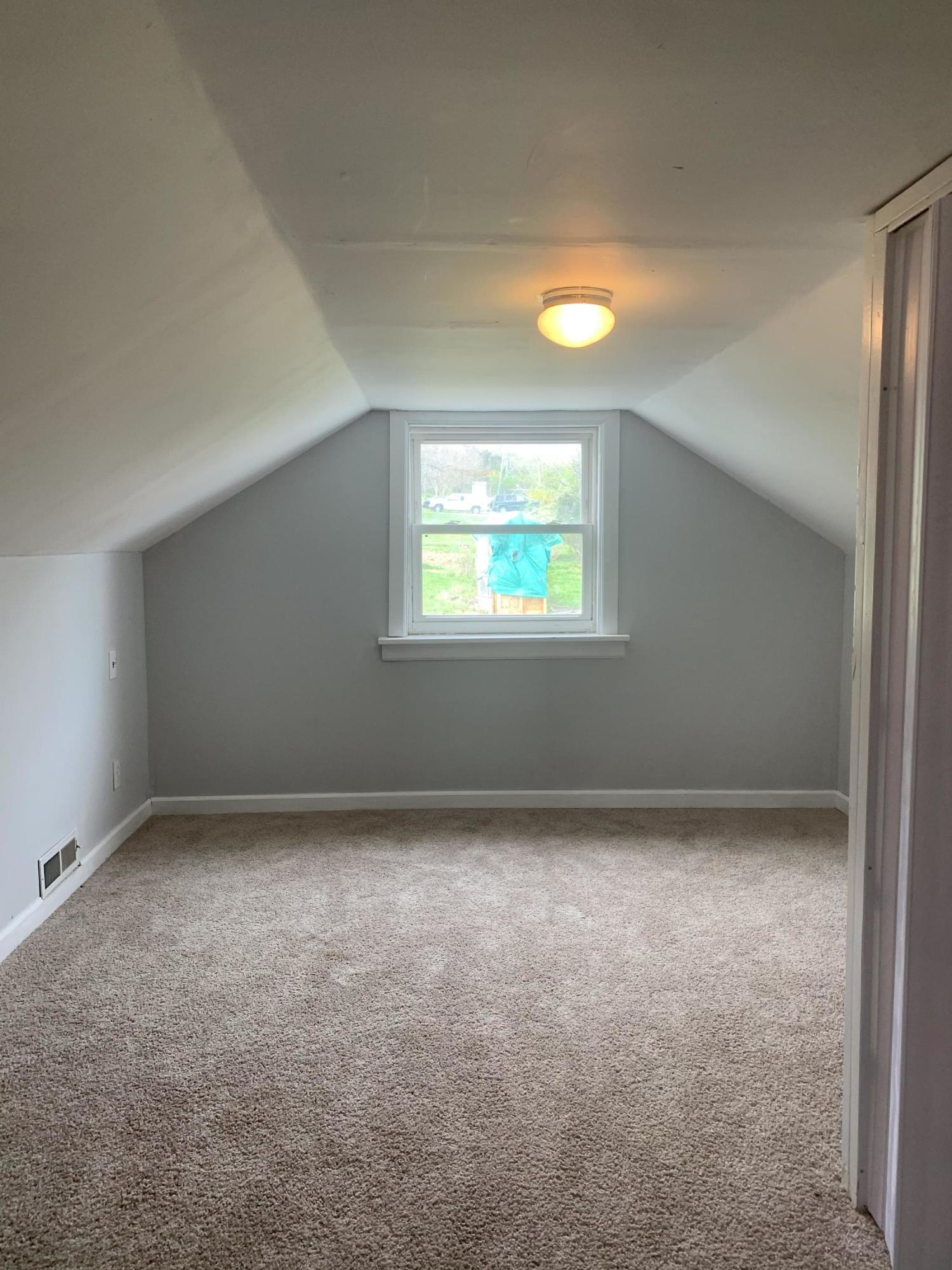 4704 Goodman Road Roanoke, VA 24014 - Photo 16 of 25 an empty room with windows and closet