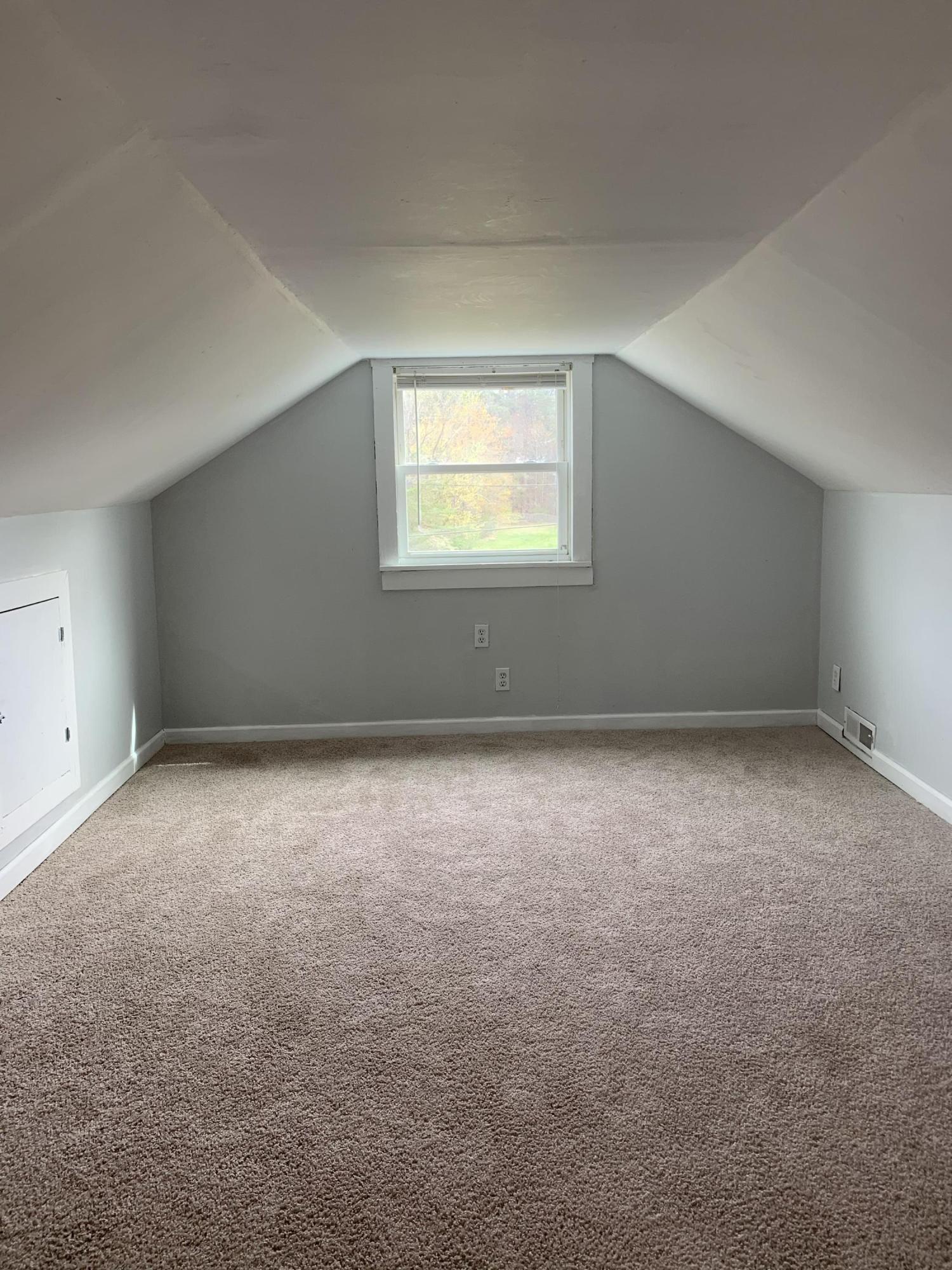 4704 Goodman Road Roanoke, VA 24014 - Photo 17 of 25 an empty room with a empty space and windows