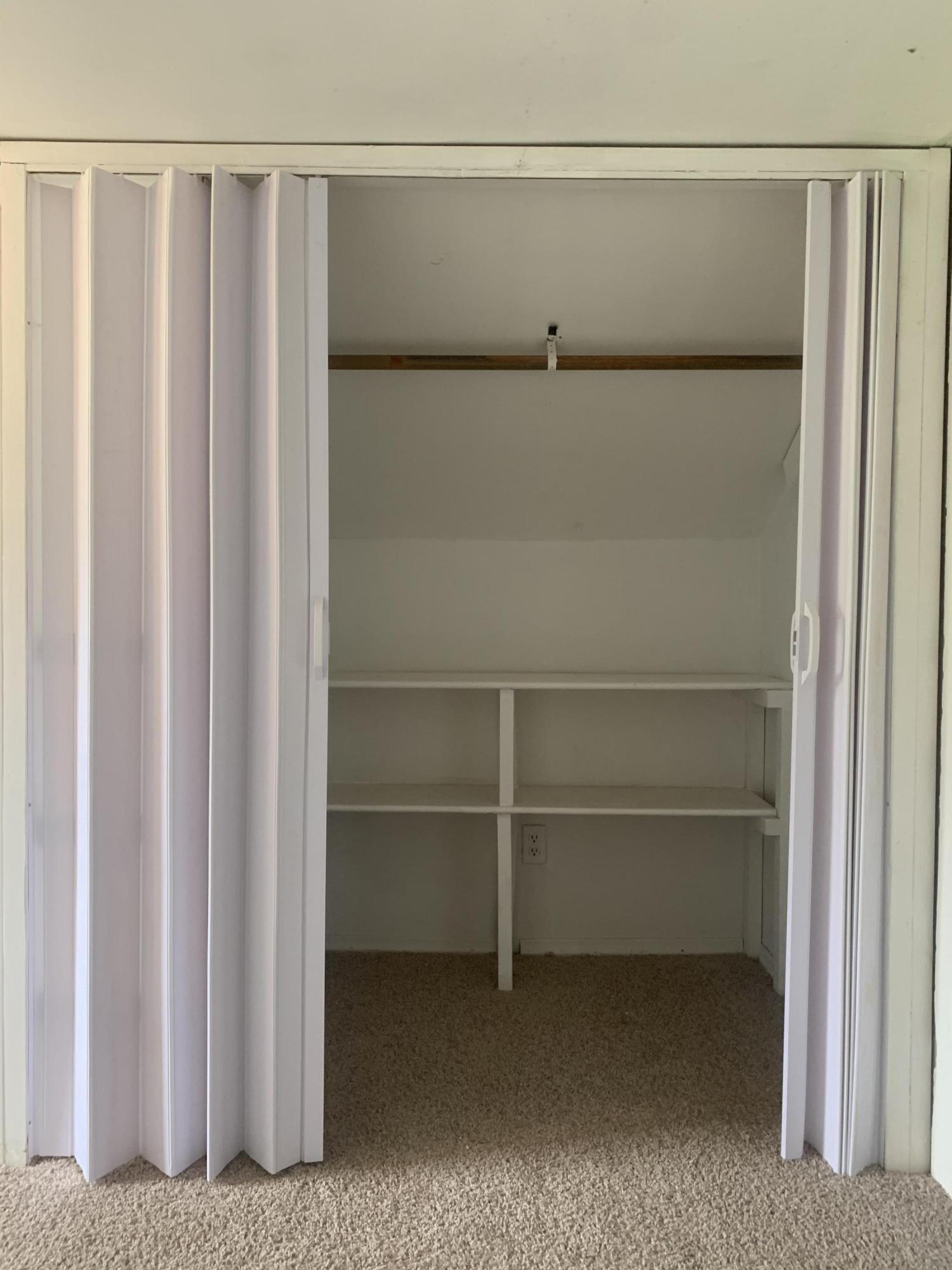 4704 Goodman Road Roanoke, VA 24014 - Photo 19 of 25 a view of walk in closet with empty racks