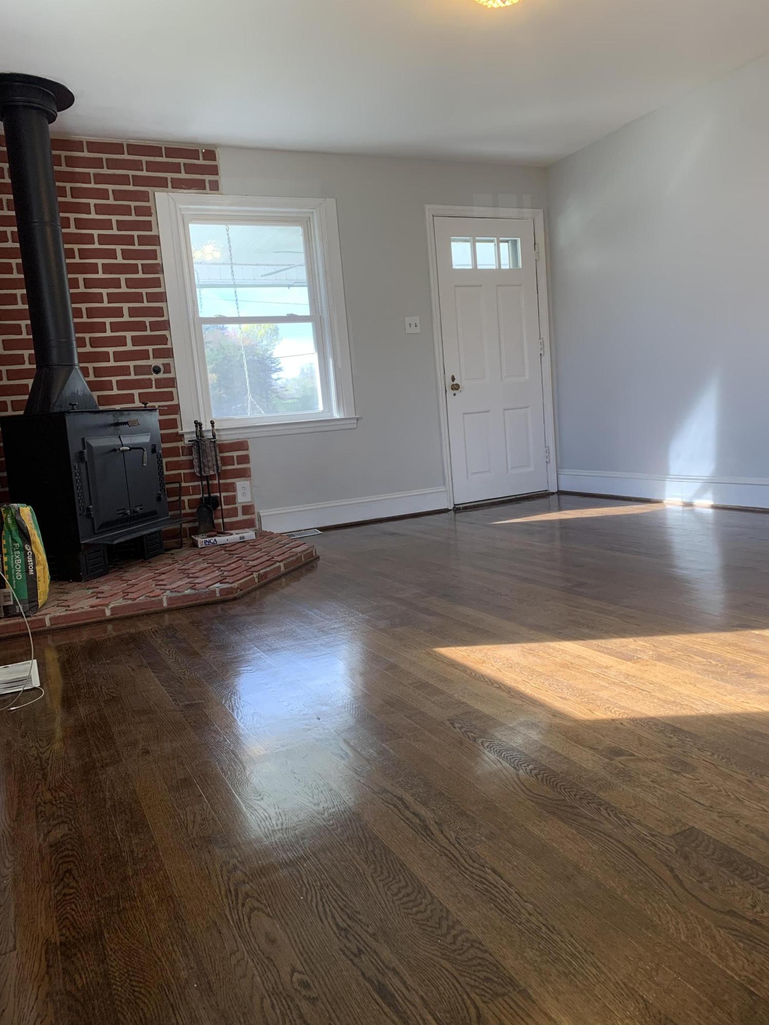 4704 Goodman Road Roanoke, VA 24014 - Photo 3 of 25 a view of empty room with wooden floor and fan