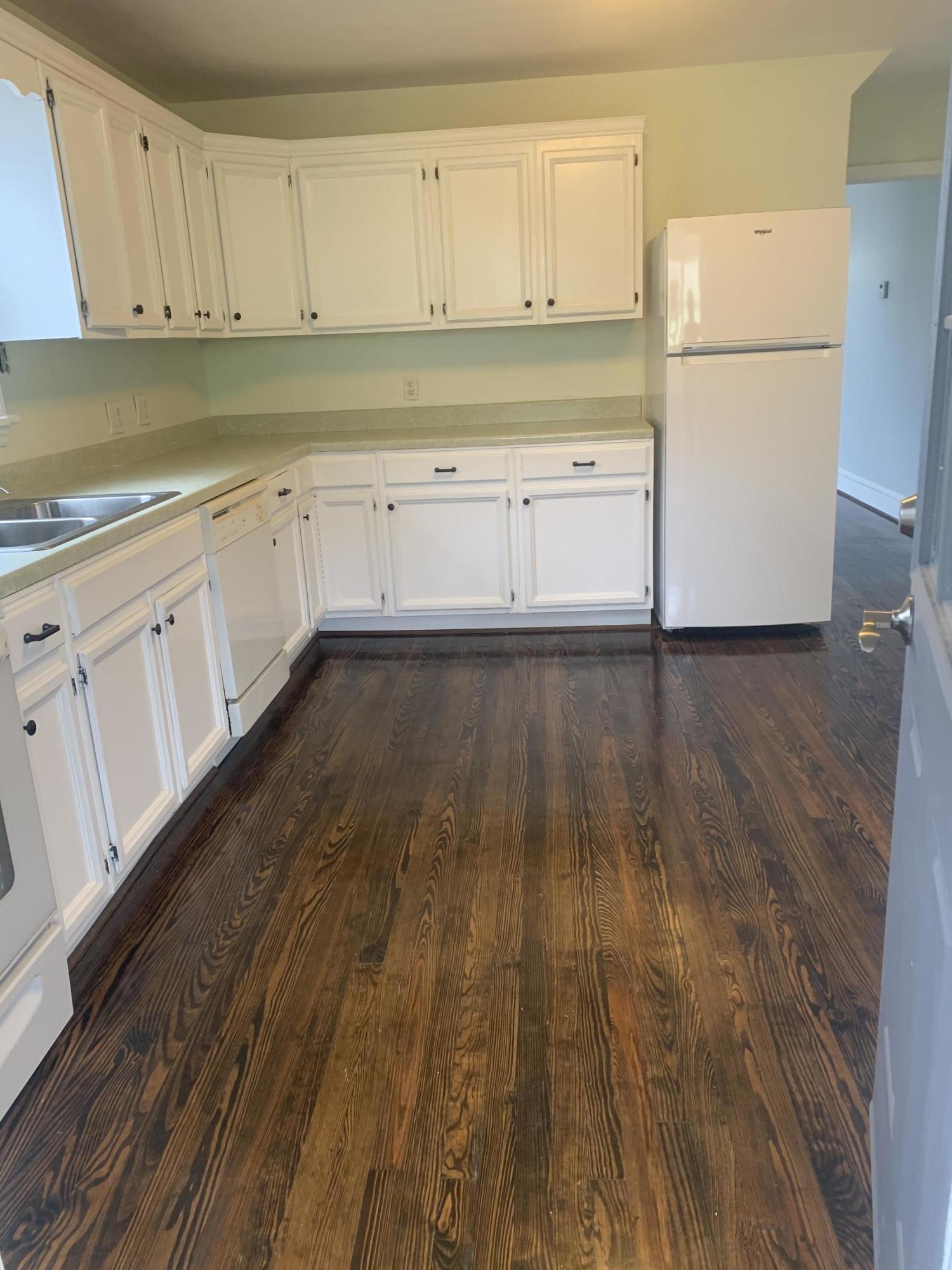 4704 Goodman Road Roanoke, VA 24014 - Photo 10 of 25 a view of a kitchen with wooden floor