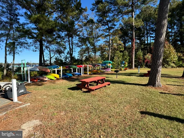 a view of a street with a bench in the background