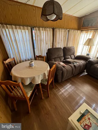 a bed sitting in a room next to a window