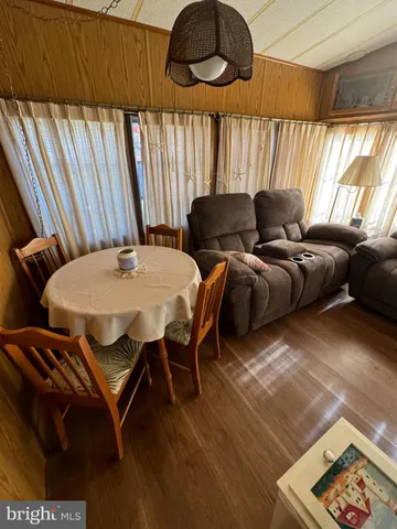 a bed sitting in a room next to a window