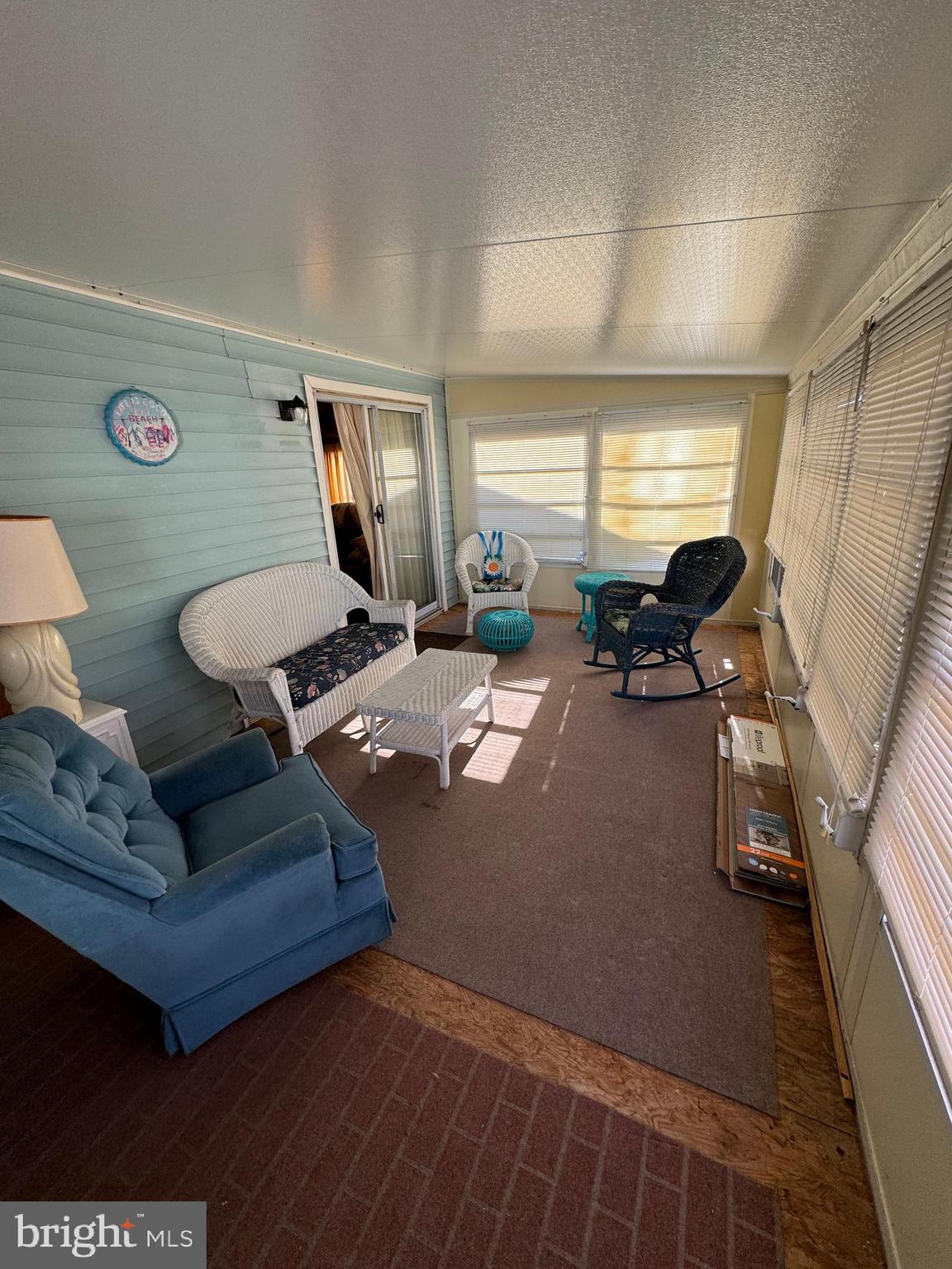 148 Ocean Oval Drive Berlin, MD 21811 - Photo 25 of 29 a living room with furniture and a window