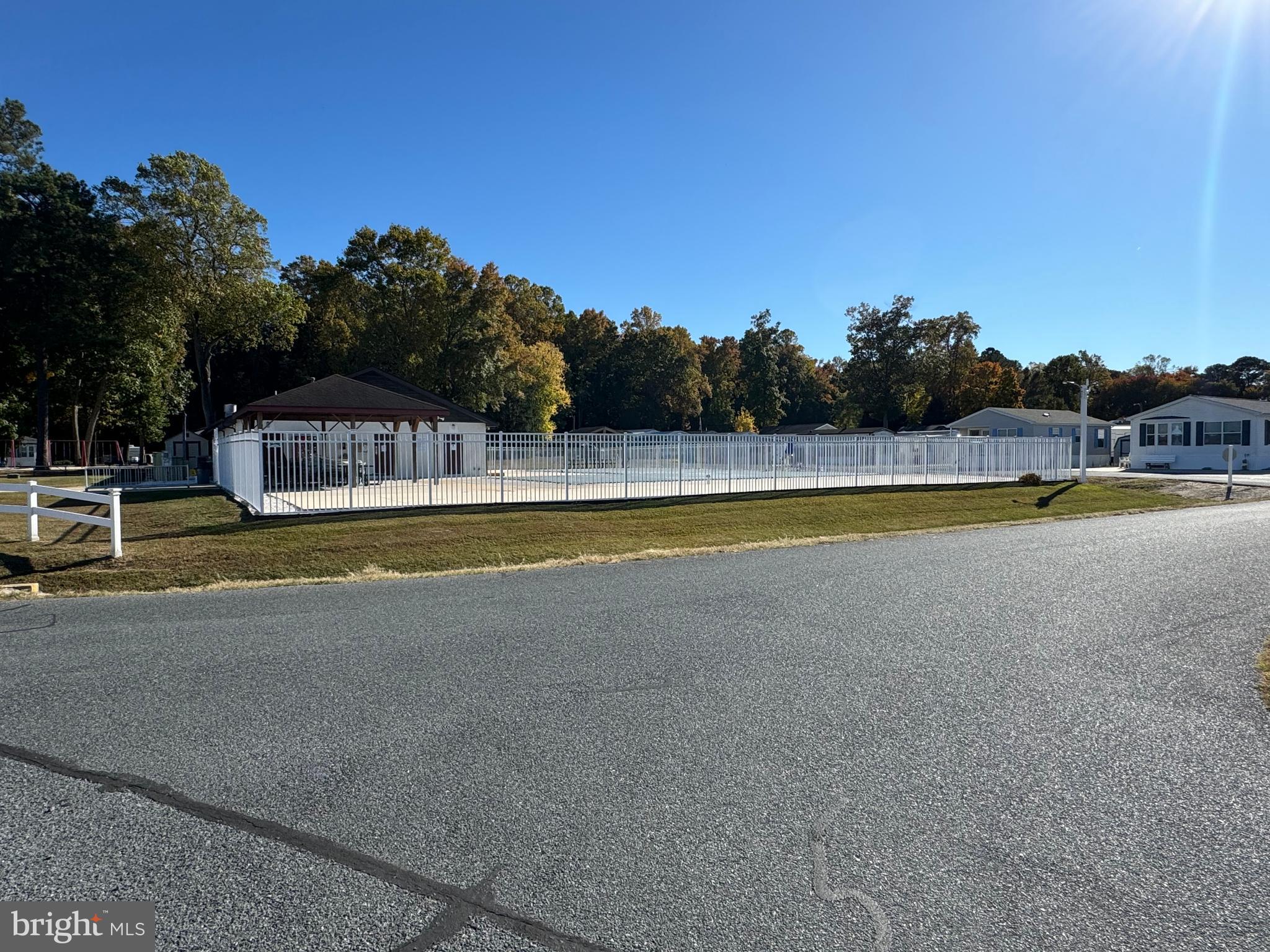 148 Ocean Oval Drive Berlin, MD 21811 - Photo 26 of 29 a view of a swimming pool with an outdoor seating and a mountain view