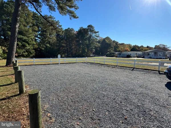 a view of a swimming pool with sitting area