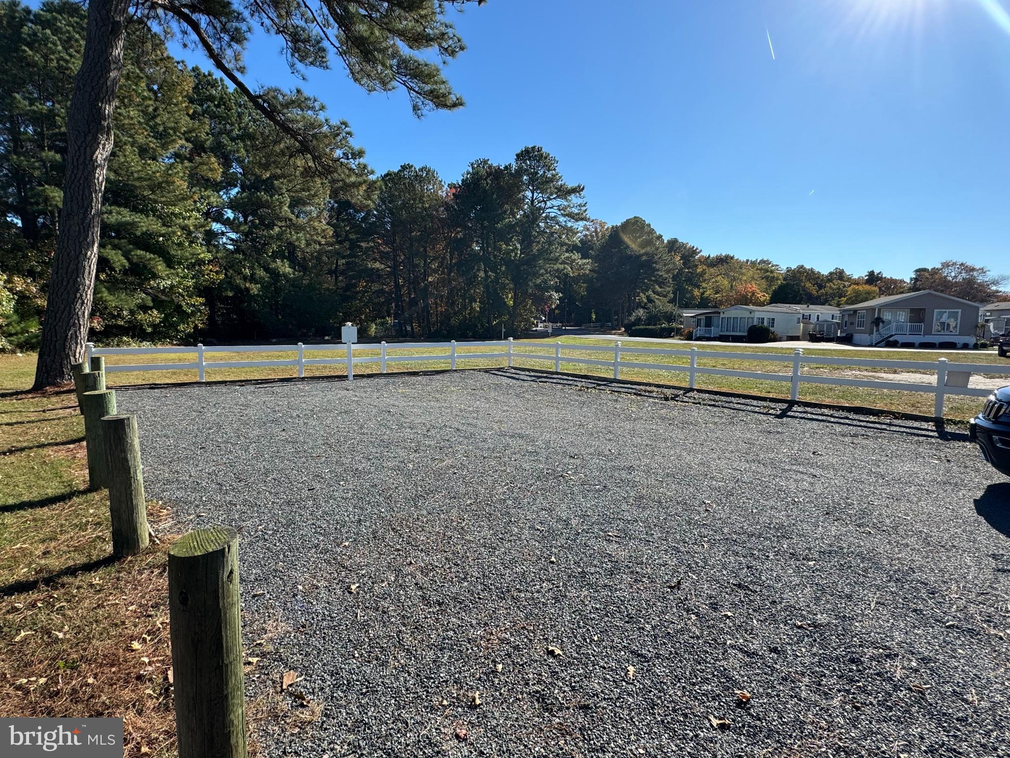 148 Ocean Oval Drive Berlin, MD 21811 - Photo 3 of 29 a view of a street with a bench in the background