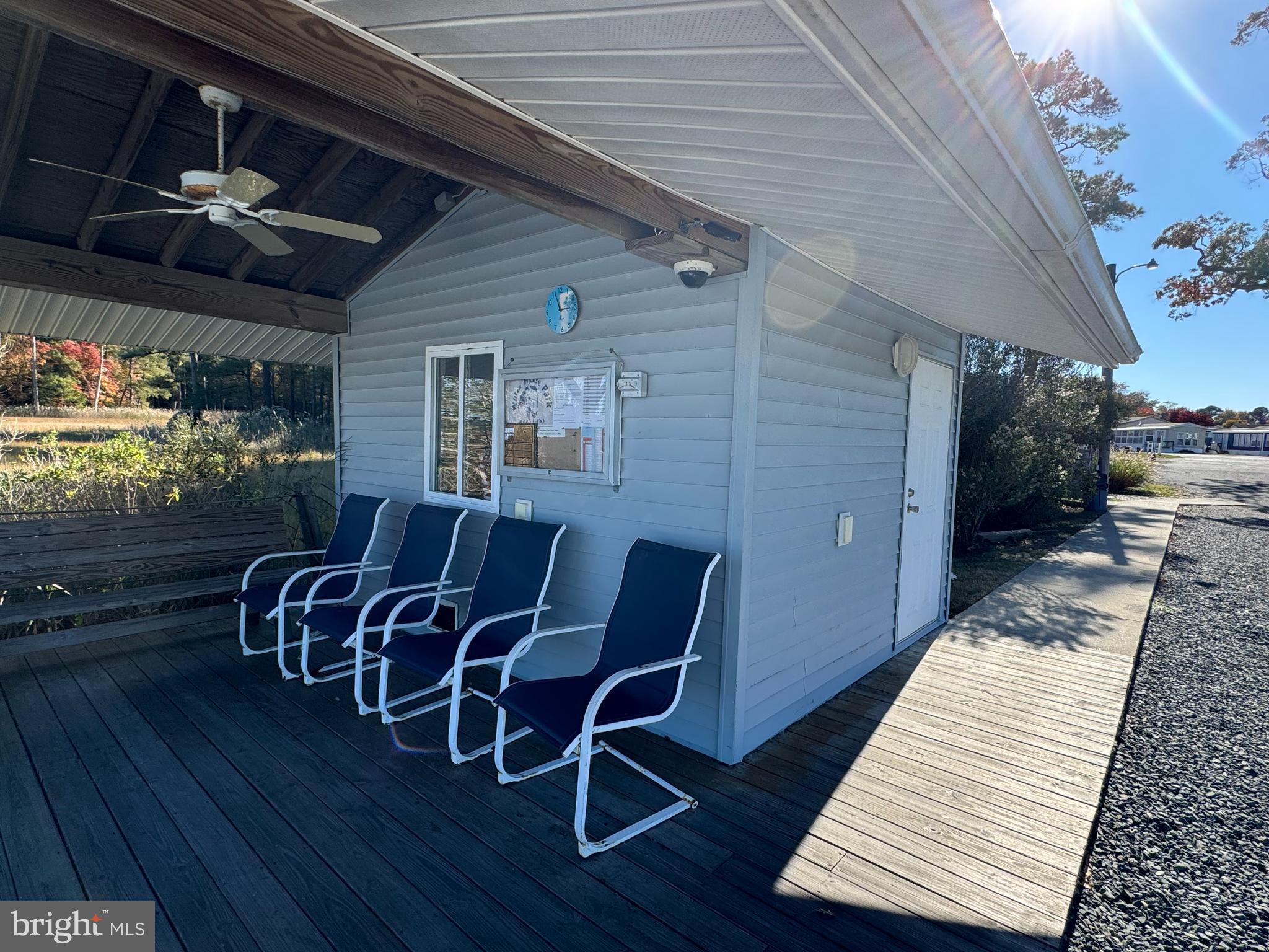 148 Ocean Oval Drive Berlin, MD 21811 - Photo 9 of 29 a view of a chairs and a tables in the patio