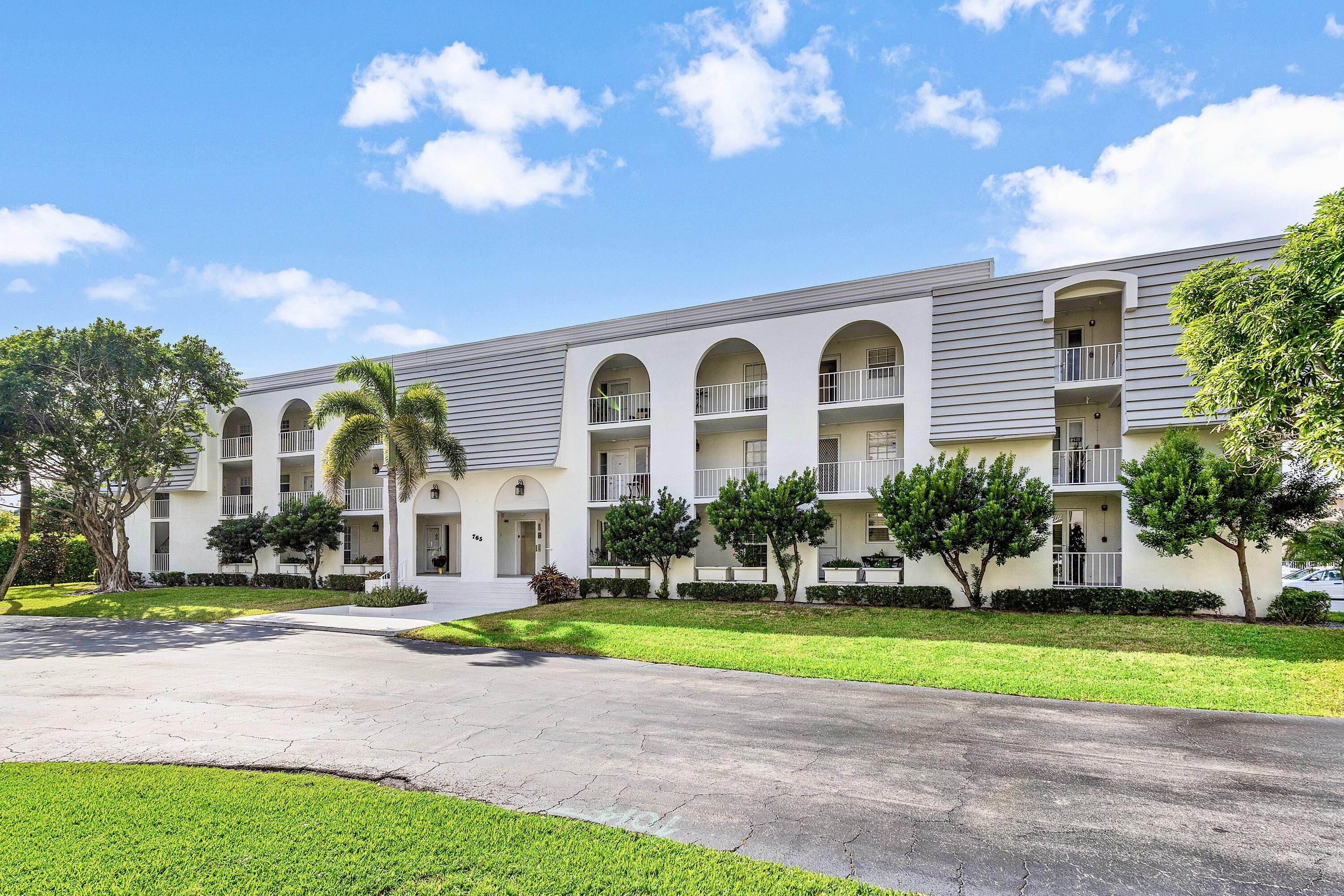 765 Jeffery Street, Unit 1203 Boca Raton, FL 33487 - Photo 1 of 31 a view of a house with a yard