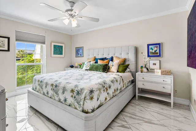 a bed sitting in a bedroom and window