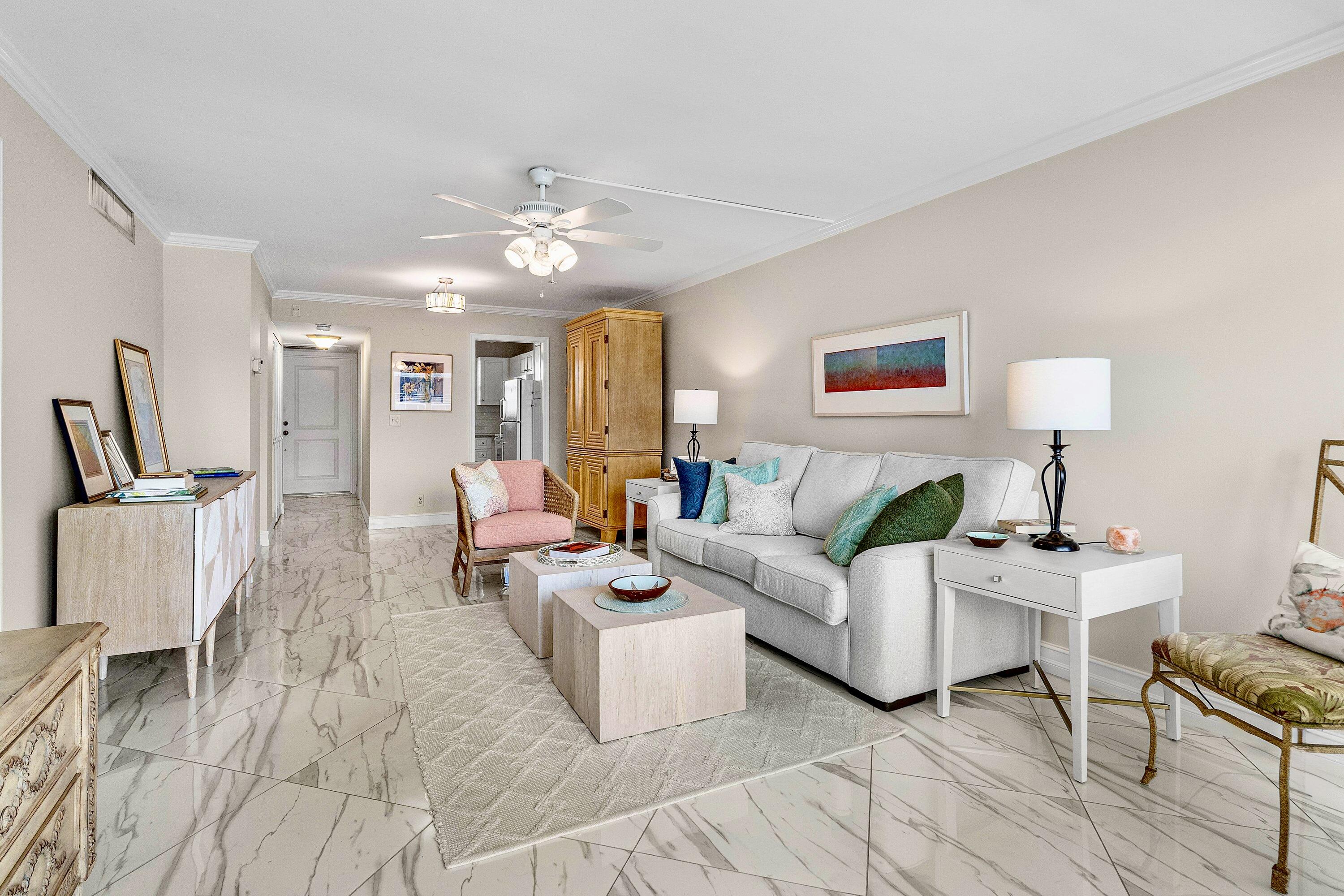 765 Jeffery Street, Unit 1203 Boca Raton, FL 33487 - Photo 4 of 31 a living room with furniture and a chandelier