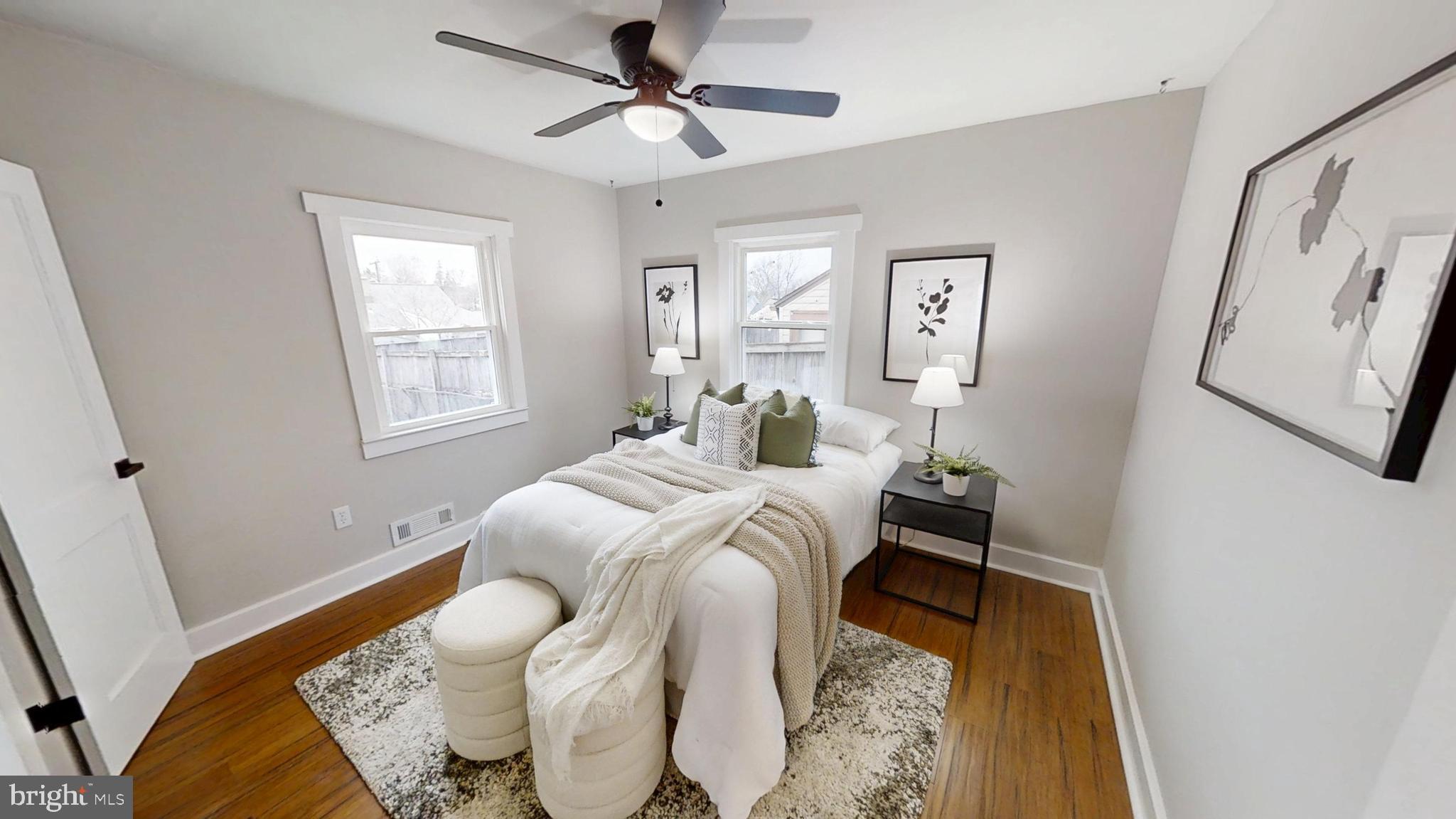 308 Holy Cross Road Baltimore, MD 21225 - Photo 12 of 28 a bedroom with a bed and wooden floor