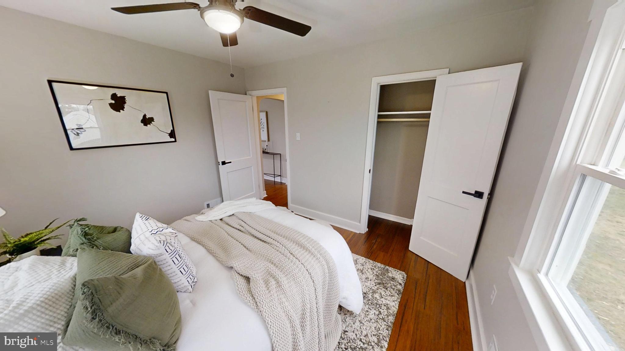 308 Holy Cross Road Baltimore, MD 21225 - Photo 13 of 28 a bedroom with a bed and a large mirror