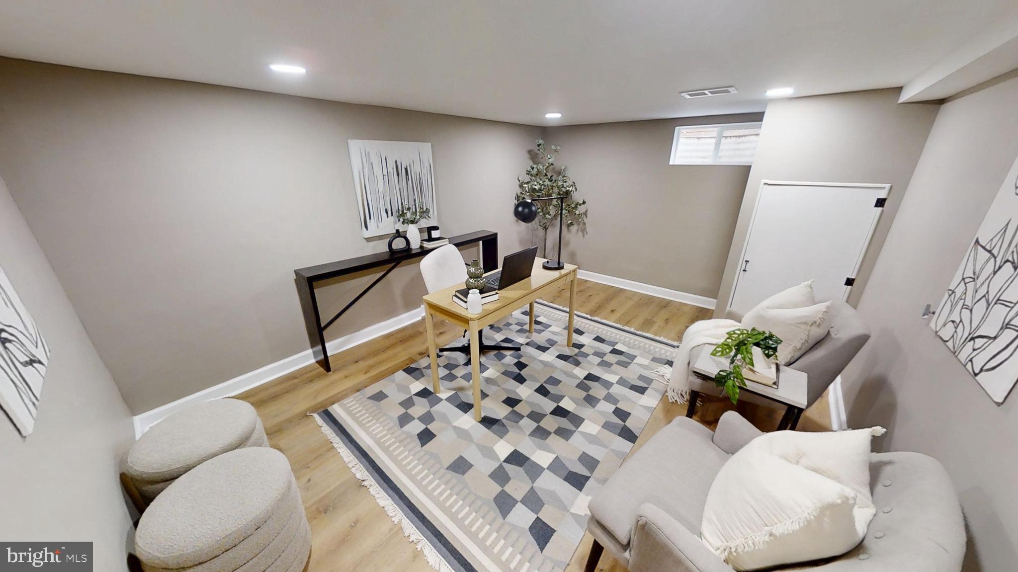 308 Holy Cross Road Baltimore, MD 21225 - Photo 19 of 28 a living room with furniture and a rug