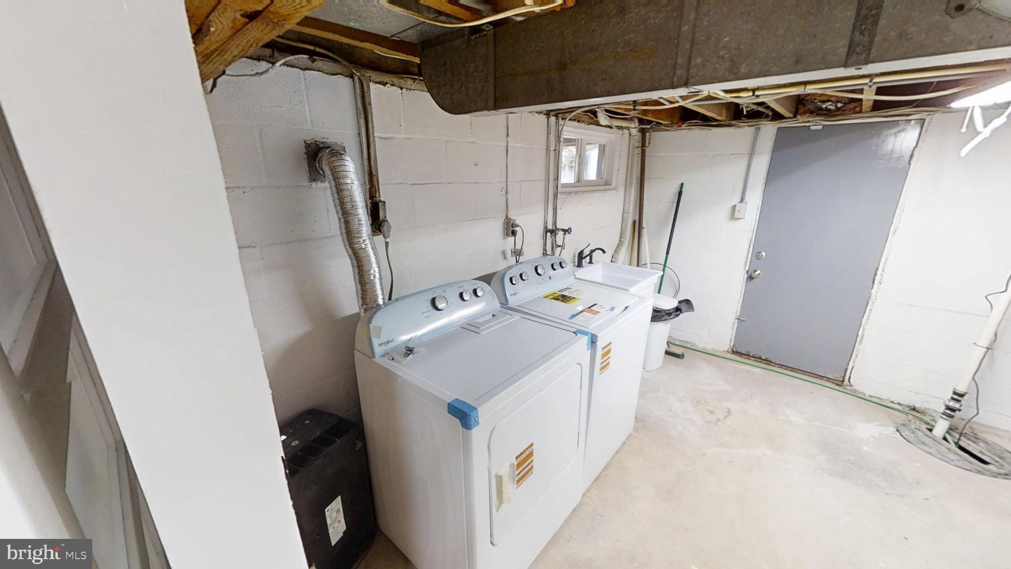 308 Holy Cross Road Baltimore, MD 21225 - Photo 24 of 28 a utility room with dryer and washer