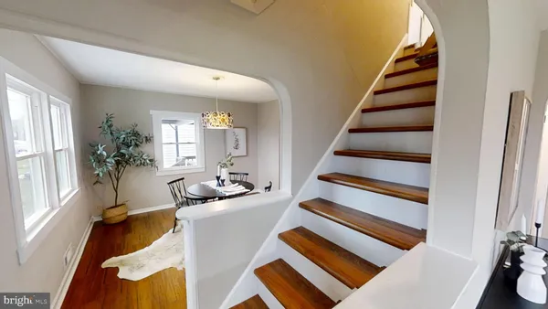 a room with furniture and staircase