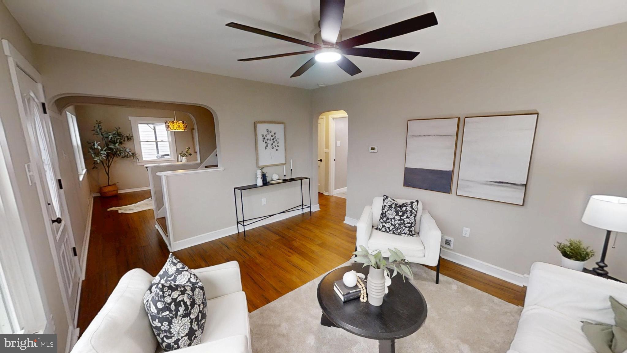 308 Holy Cross Road Baltimore, MD 21225 - Photo 9 of 28 a bedroom with furniture and a wooden floor