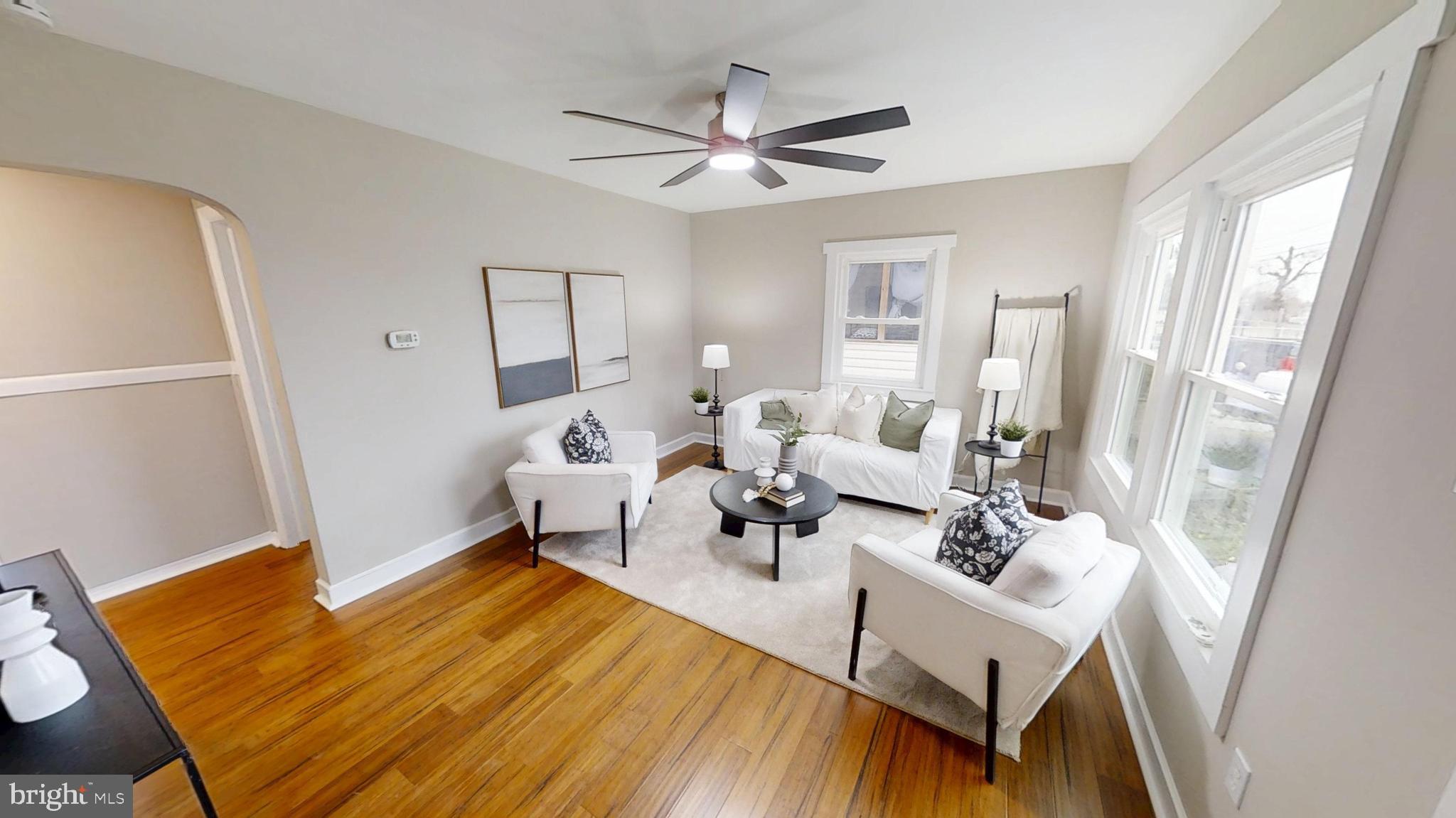 308 Holy Cross Road Baltimore, MD 21225 - Photo 10 of 28 a living room with furniture and a table