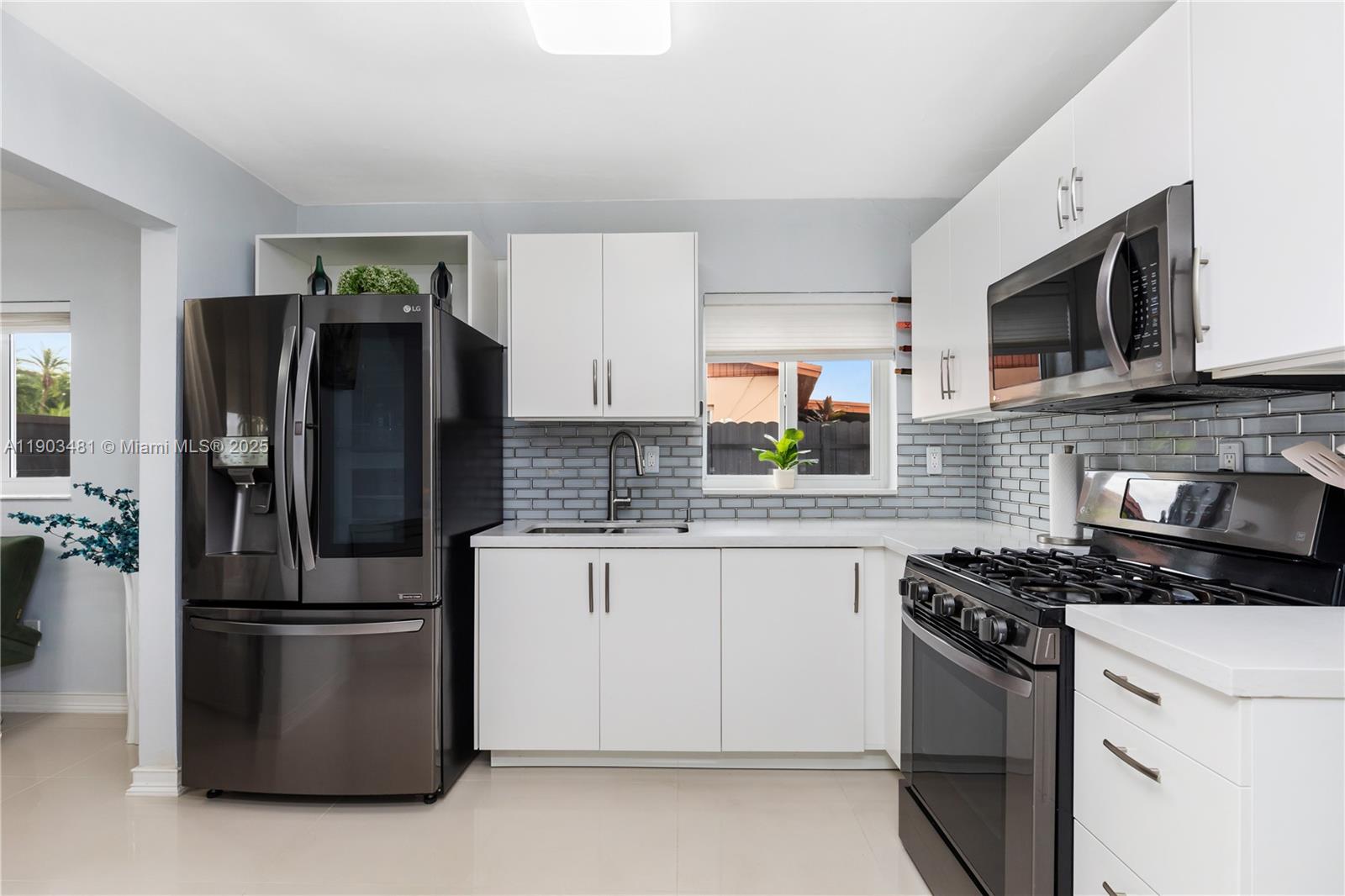 2670 Southwest 119th Court Miami, FL 33175 - Photo 13 of 39 a kitchen with a refrigerator stove and microwave