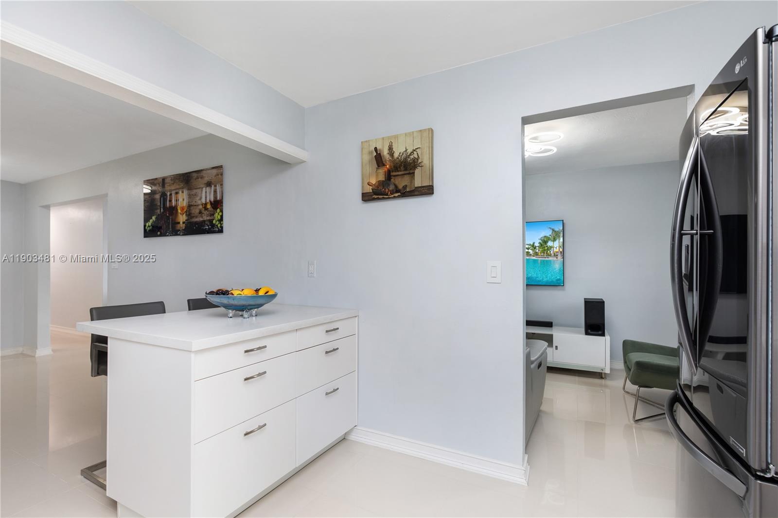 2670 Southwest 119th Court Miami, FL 33175 - Photo 14 of 39 a room that has a dresser and a flat screen tv